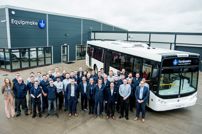 Equipmake Team with White Bus